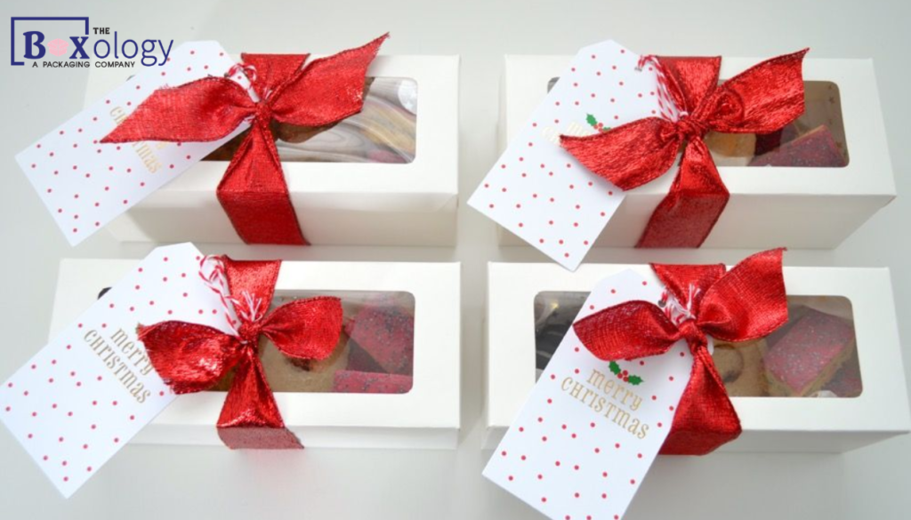 Festive Christmas cookie gift box packaging styled for holiday corporate catering.